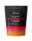 Black pouch with pink and orange gradient base labeled "Performance Electrolytes Strawberry Tropic" with ingredient icons and