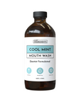 Brown glass bottle of Cool Mint mouth wash with a white label, 16 oz, featuring dentist formulated details.