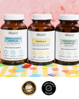 Three amber glass bottles labeled Methylated B Complex, Omega-3, and Magnesium Complex on colorful geometric background.