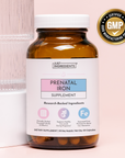 Brown glass bottle with white cap labeled "Just Ingredients Prenatal Iron Supplement" containing 30 capsules, with GMP certif