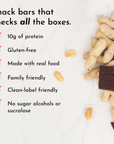 Peanut butter chocolate chip snack bar with peanuts and chocolate pieces on a marble surface.