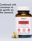 Brown glass bottle of Berberine Complex Supplement with white label and two gold capsules displayed in front.