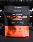 Black and orange pouch of Watermelon Lime Performance Pre-Workout with ingredient icons and nutrition details displayed on fr