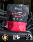 Black and pink pouch of Pink Dragon Performance Pre-Workout powder with ingredient icons and certification badges displayed o