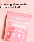 Pink product box for Energy + Brain Boost Raspberry Lemonade, labeled caffeine‑alternative and featuring real fruit callouts.