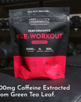Black and pink pouch of Just Ingredients Performance Pre-Workout in Pink Dragon flavor with ingredient specifications and ben
