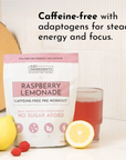 Caffeine-free raspberry lemonade pre-workout powder in a bag with a glass of drink and fresh lemon and raspberries.