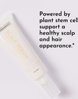 Cream-colored scalp serum tube labeled "Just Ingredients Scalp Serum" on light gray background.