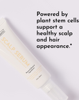White tube of scalp serum with spray nozzle labeled "SCALP SERUM" on a clean background.