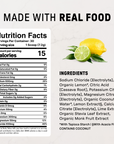 Lemon lime electrolyte powder with nutrition facts label and fresh lemon and lime halves with green leaves on right side.