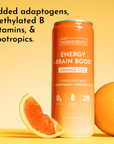 Orange can with "Energy + Brain Boost" label next to a sliced orange on a yellow background.