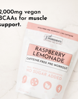 Caffeine-free pre-workout powder package labeled "Raspberry Lemonade" with details on BCAAs and ingredients.