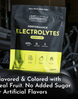 Black and yellow pouch of Lemon Lime Performance Electrolytes with nutritional information and ingredient icons displayed on