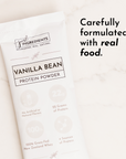 Vanilla bean protein powder stick with nutritional information and claims printed on a white background.
