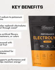 Black and orange electrolyte powder pouch labeled "Performance Electrolytes Orange" with key benefits listed on the left side