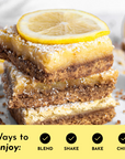Stack of lemon bars topped with a lemon slice, dusted with powdered sugar on a plate.