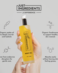 Clear glass bottle of Sweet Citrus body oil with yellow liquid and pump top, labeled 'Just Ingredients.'