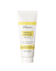 White tube of body lotion with yellow accents, labeled "Tropical Paradise," containing shea butter and jojoba oil.