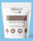 White pouch of Coconut Chocolate Protein Powder showing branding and nutrition panel.