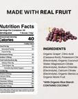 Purple pouch labeled Grape Electrolytes beside a glass of grape drink with ice.