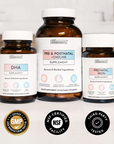 Three brown glass bottles with white caps labeled DHA Supplement, Pre & Postnatal + Choline Supplement, and Prenatal Iron Sup