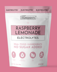 Pouch labeled 'Raspberry Lemonade Electrolytes' with product details and pink-and-white packaging.