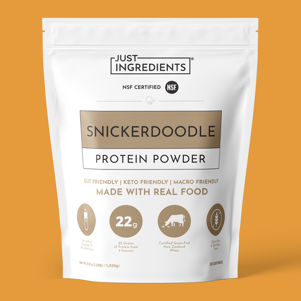 White pouch of Snickerdoodle protein powder with gold accents and nutrition panel visible.