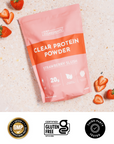 Pink pouch of Strawberry Slush Clear Protein Powder with 20g protein per serving, surrounded by fresh strawberries.