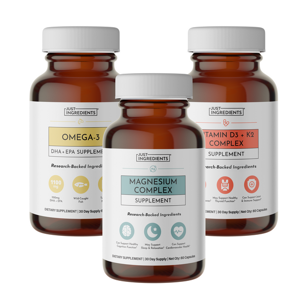 Three amber glass supplement bottles labeled Omega-3, Magnesium Complex, and Vitamin D3 + K2 Complex with white caps.