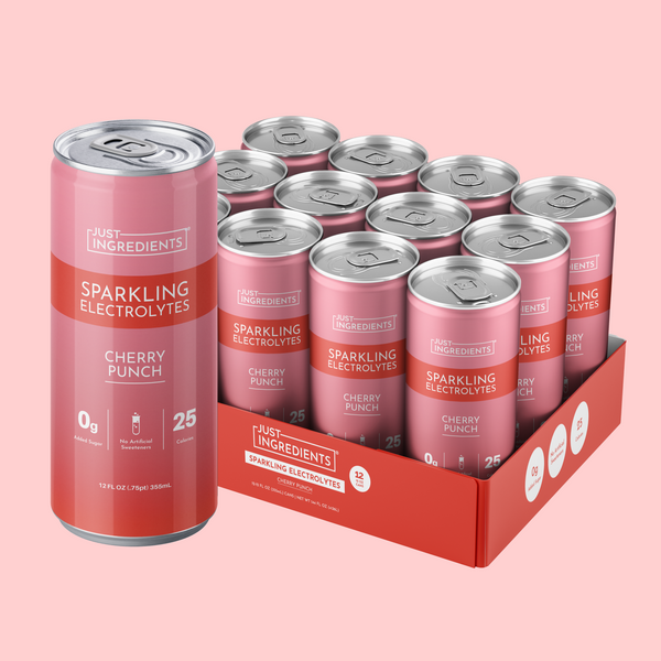 Pack of pink and red cans labeled "Just Ingredients Sparkling Electrolytes Cherry Punch" with 12 oz cans in a red cardboard b
