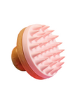 Scalp scrubber with a pink silicone bristle head and a wooden handle for easy grip.