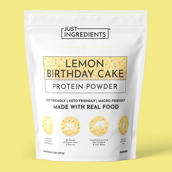 White pouch of Just Ingredients Lemon Birthday Cake Protein Powder with yellow banner label and colorful sprinkle illustratio
