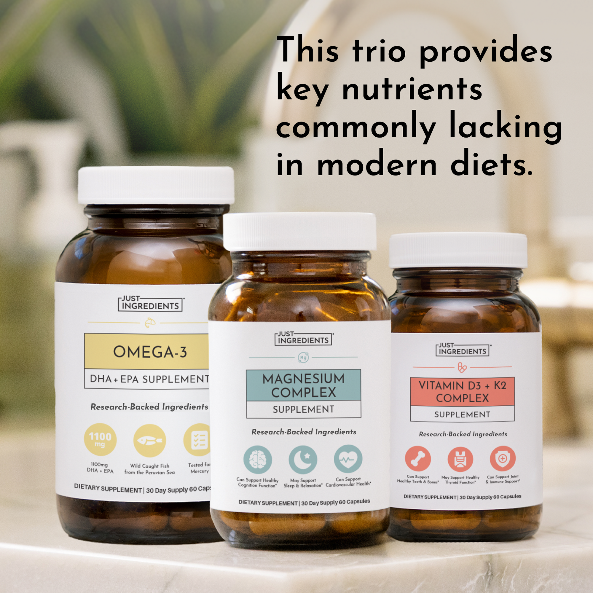 Three amber glass supplement bottles with white caps labeled Omega-3, Magnesium Complex, and Vitamin D3 + K2.