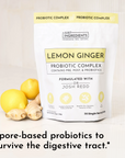 White pouch labeled "Lemon Ginger Probiotic Complex" with lemons and ginger root beside it, featuring product details.