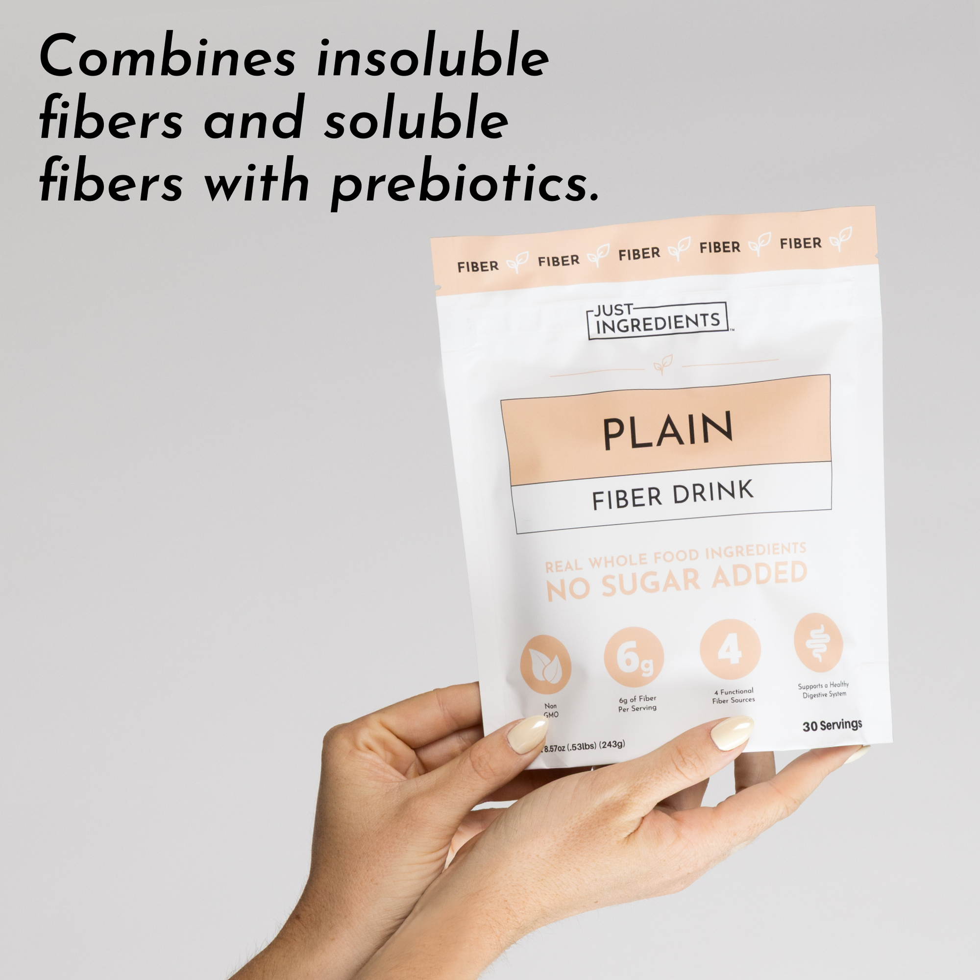 A person holds a white and peach package labeled "Plain Fiber Drink" with nutritional information and claims.