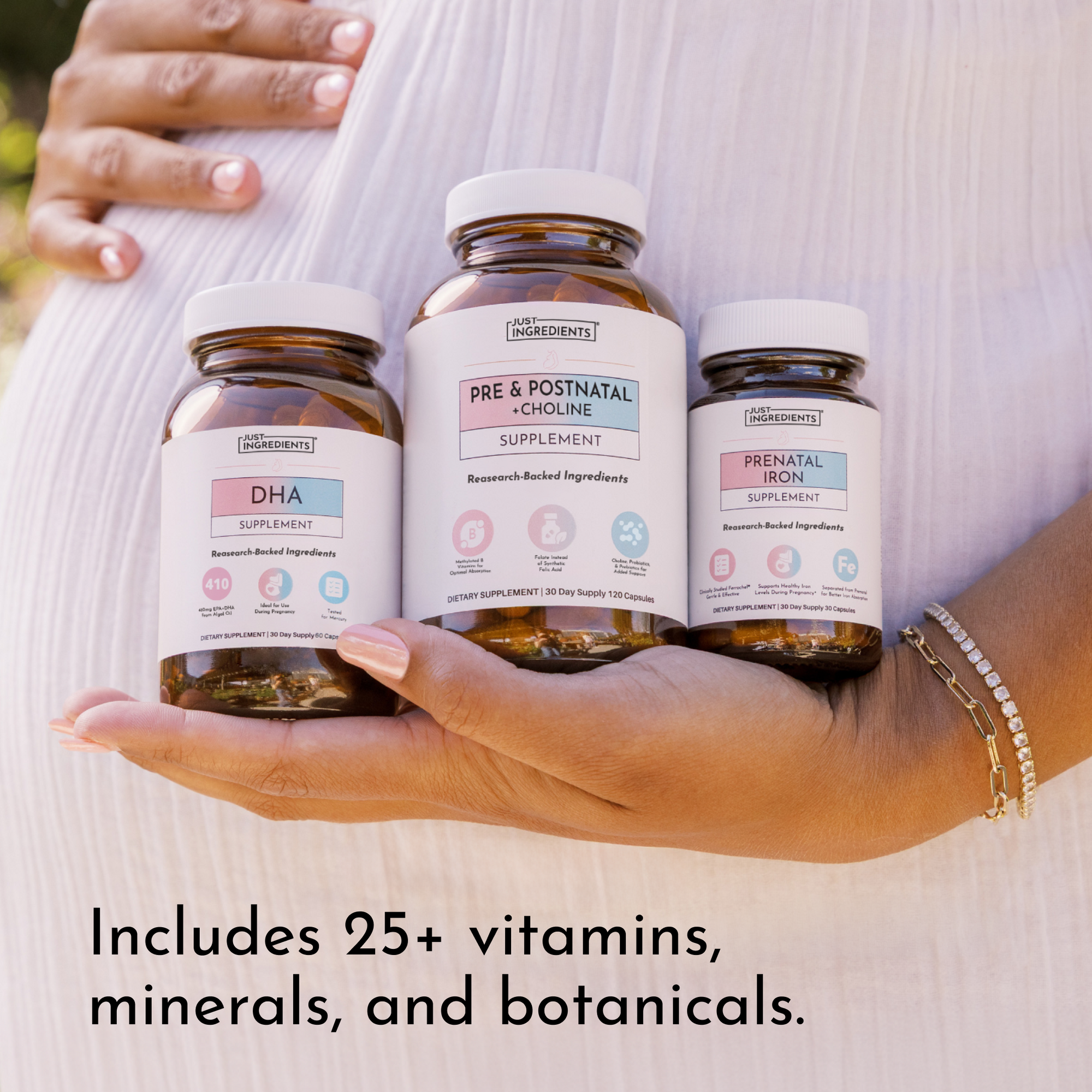 Hand holding three brown glass supplement bottles labeled DHA, Pre &amp; Postnatal + Choline, and Prenatal Iron against a white s