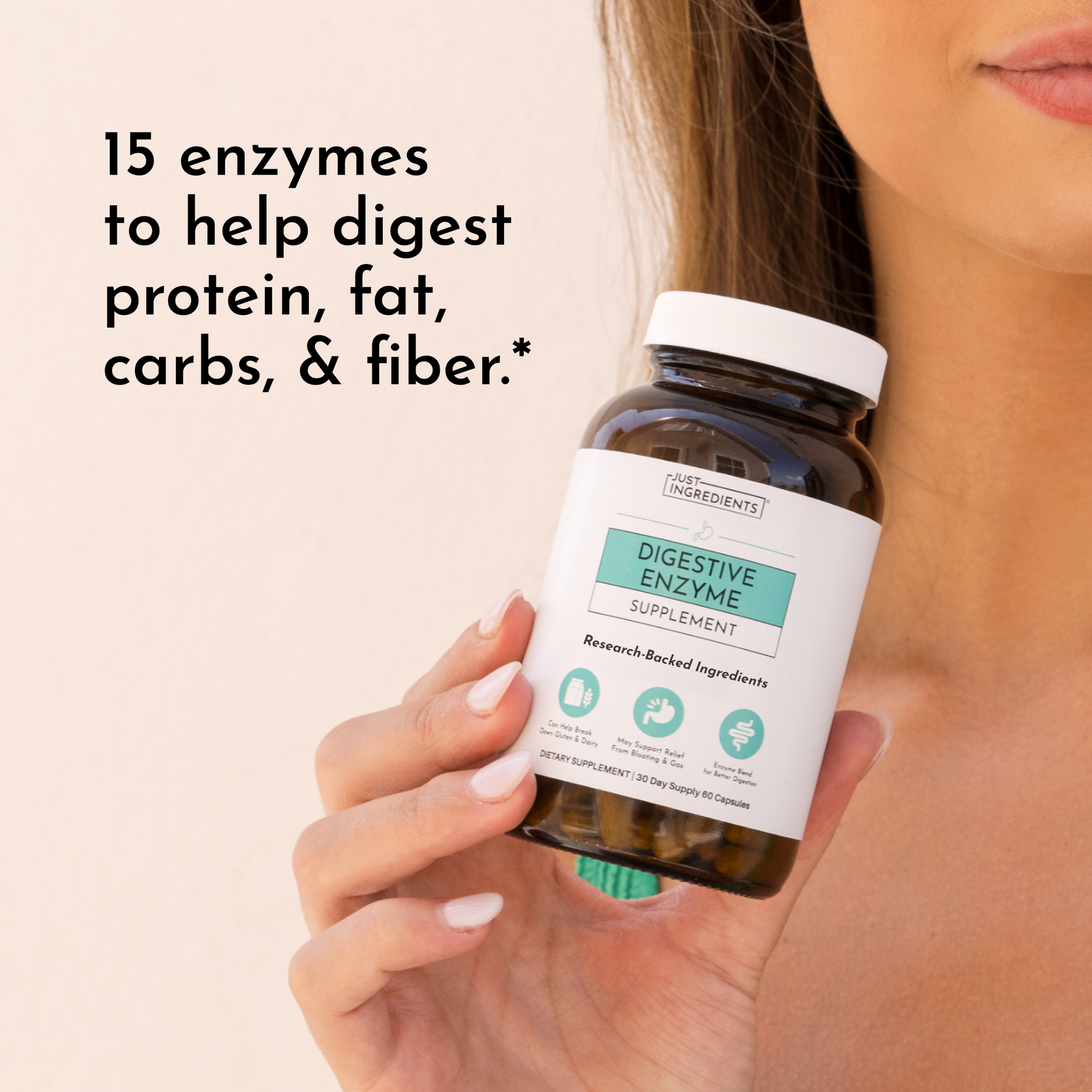 Woman holding brown glass bottle of digestive enzyme supplement with white label and white cap.