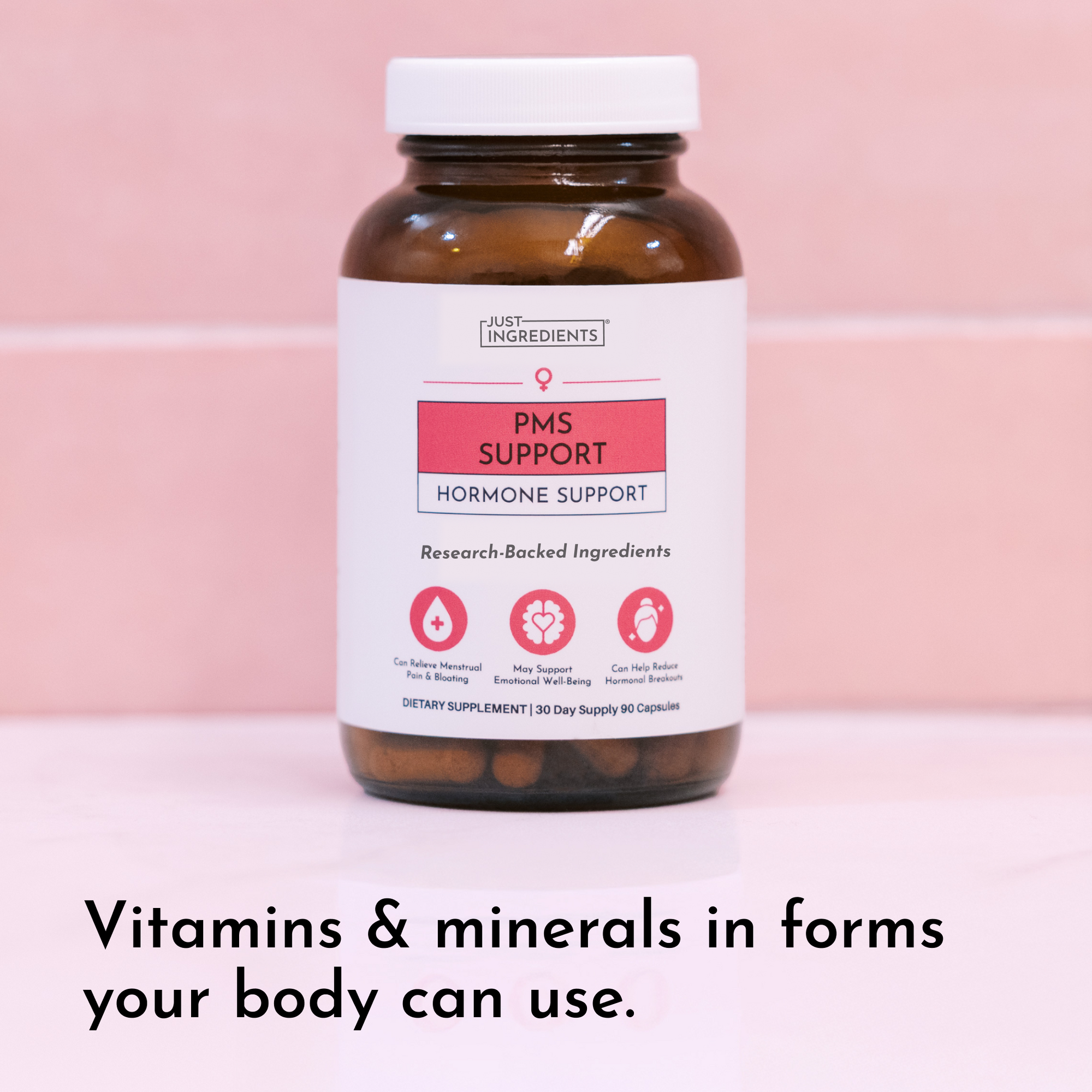 Dark amber glass bottle with white cap and label reading "PMS Support Hormone Support" against pink background.