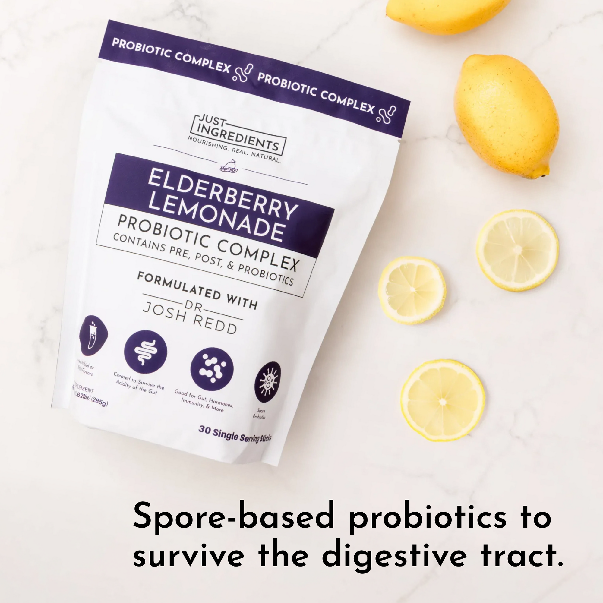 Pouch of Elderberry Lemonade Probiotic Complex with sliced lemons on a marble surface.