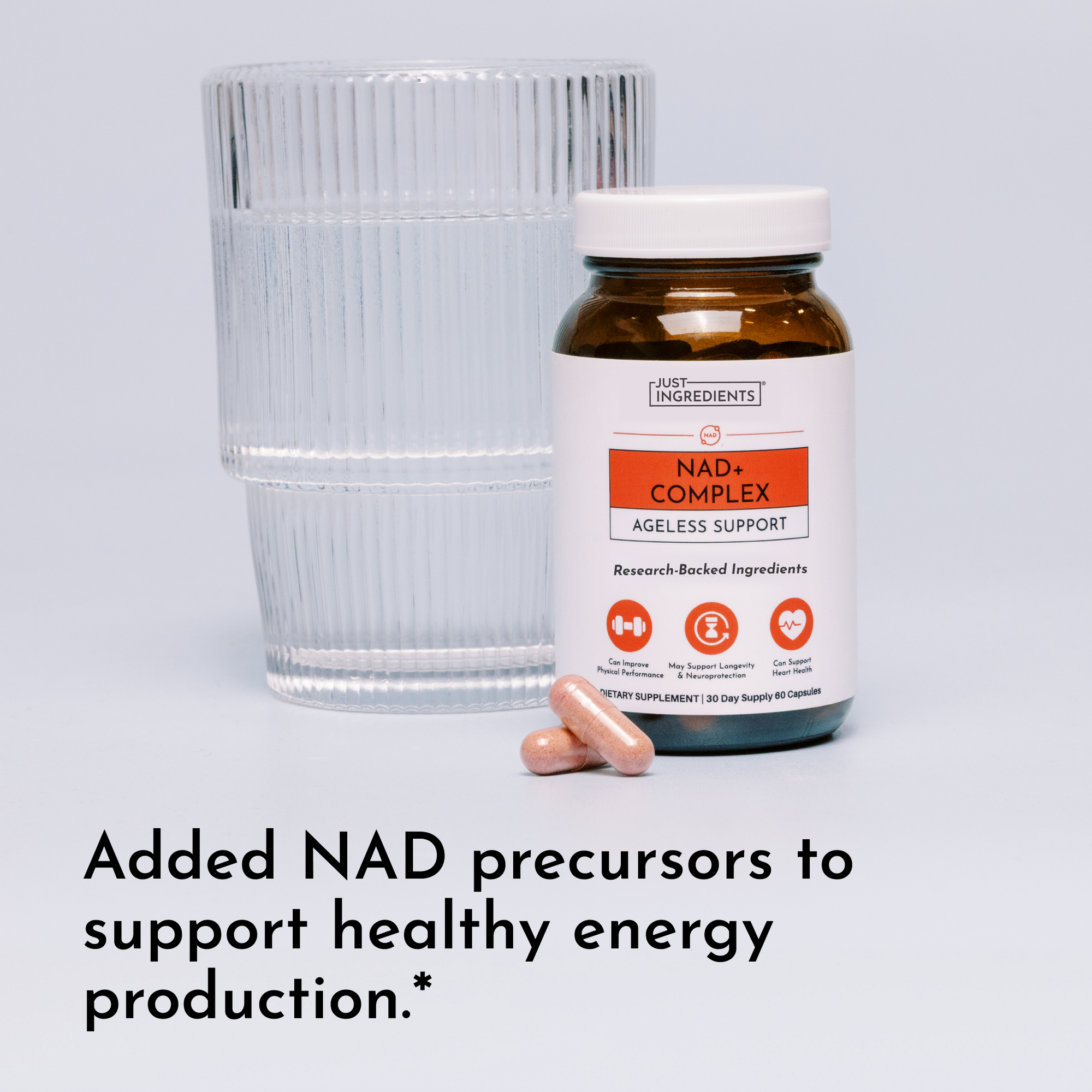 NAD+ Complex supplement bottle with white cap next to glass of water and two capsules.