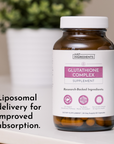 Brown glass bottle with white cap containing Glutathione Complex supplement capsules, labeled "Just Ingredients" with product