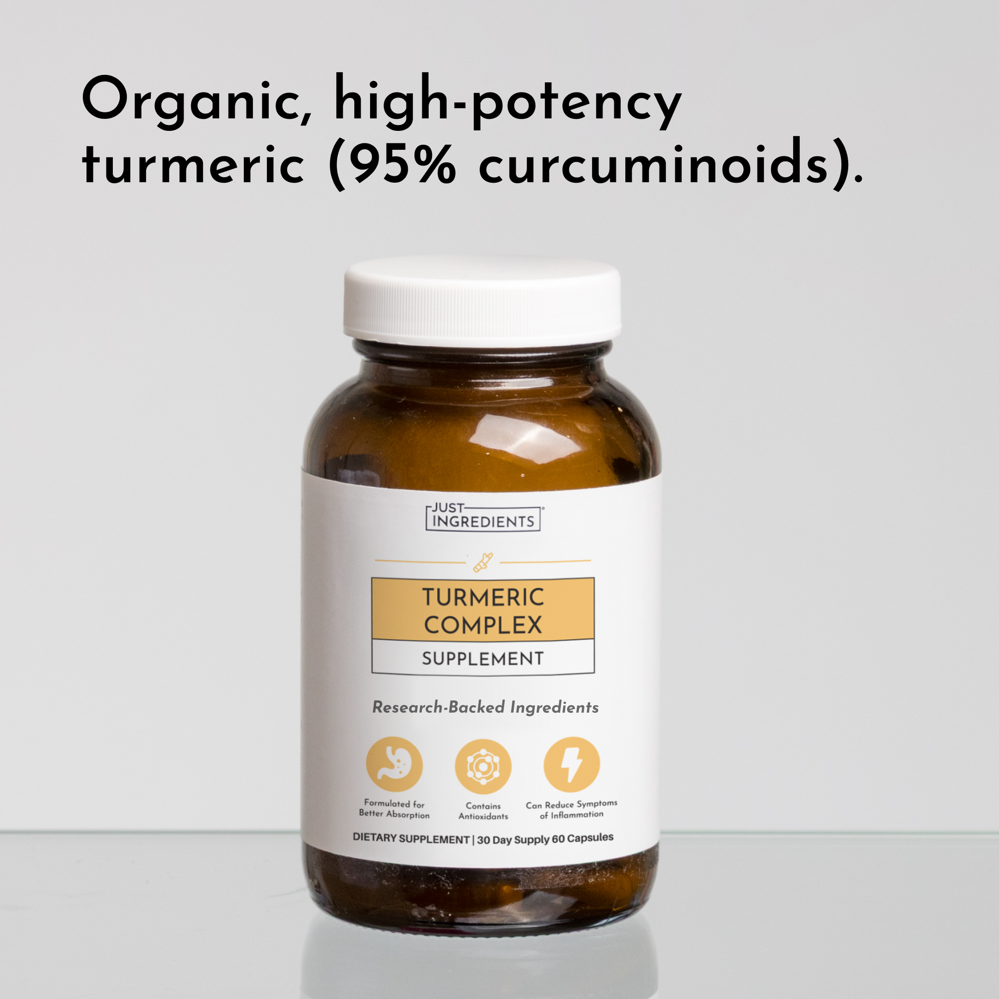 Amber glass bottle of Turmeric Complex supplement with white cap and label on gray background.