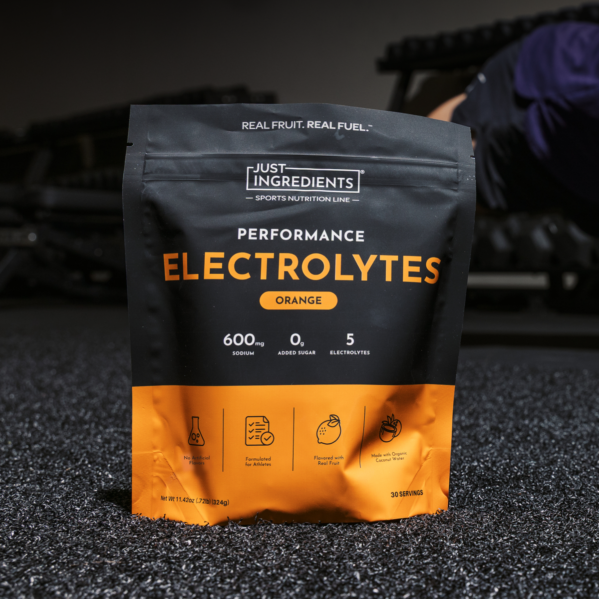 Black and orange pouch of Just Ingredients Performance Electrolytes in orange flavor with nutrition information and ingredien