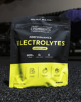 Black and yellow pouch of lemon lime electrolyte powder with nutrition information and icons displayed on front.