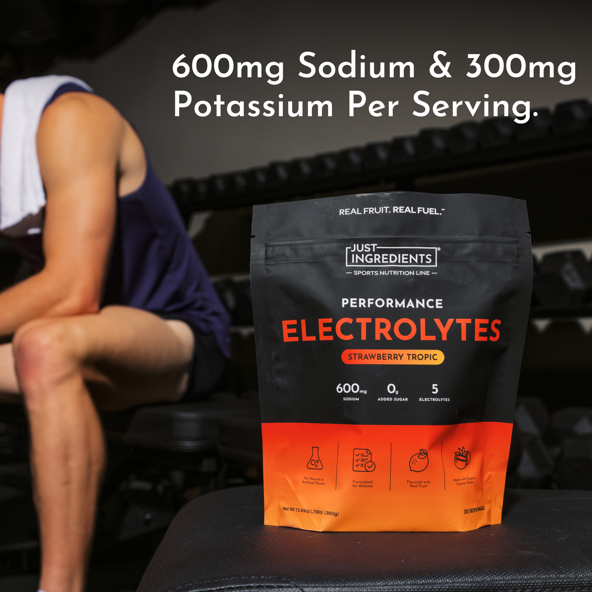 Black and orange pouch of Just Ingredients Performance Electrolytes in Strawberry Tropic flavor with nutritional information 