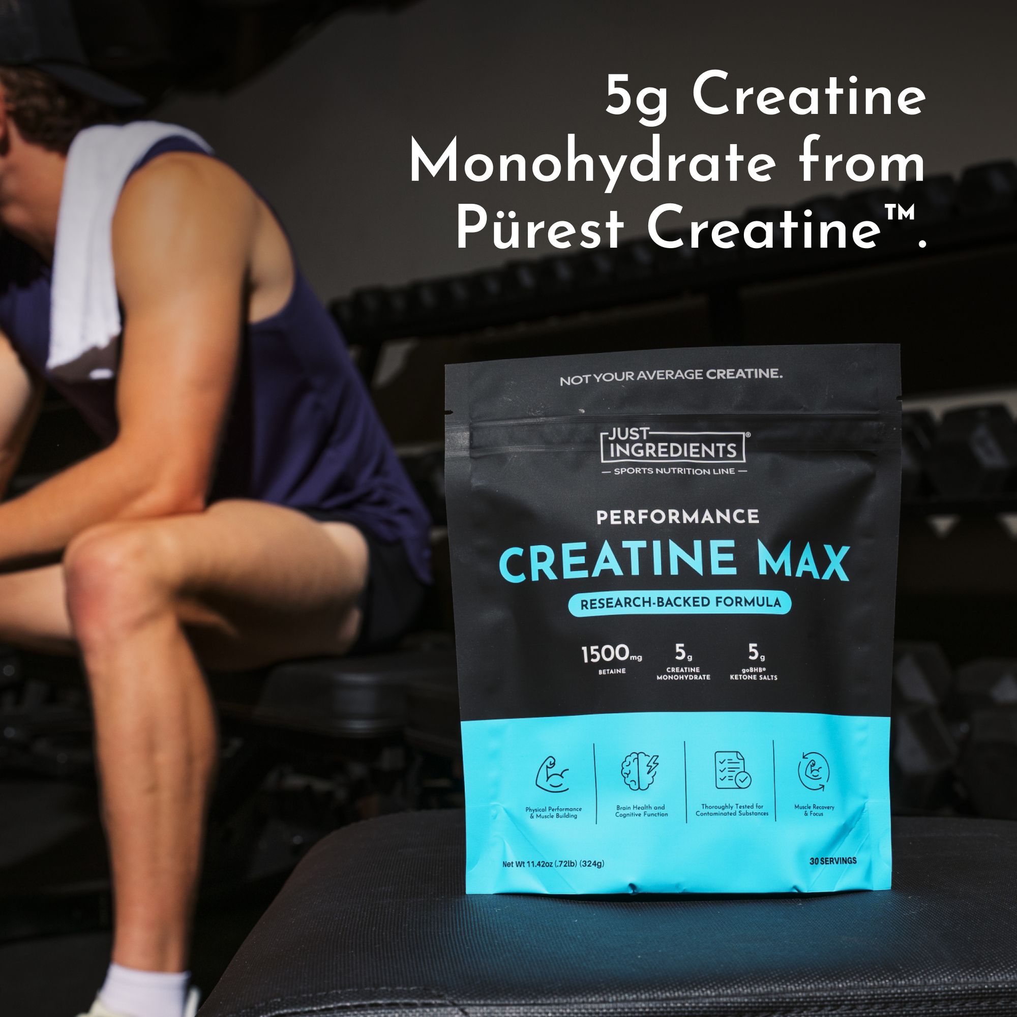 Black and turquoise Creatine Max powder pouch displaying 5g creatine monohydrate, positioned next to person in gym setting.