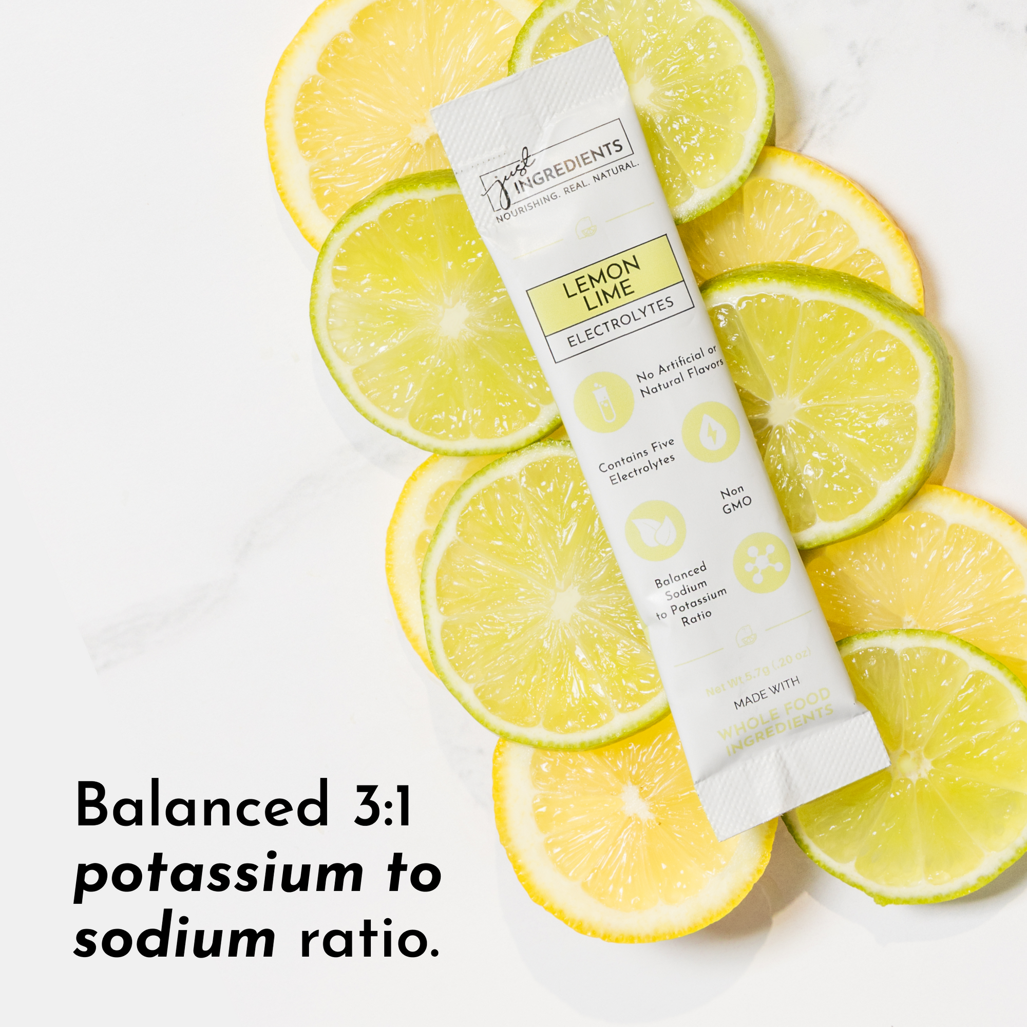 Electrolyte stick packet placed on sliced lemon and lime, featuring product details and a balanced potassium to sodium ratio.