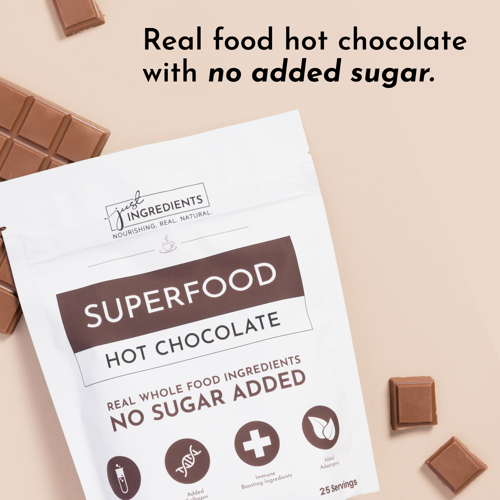 White pouch labeled "Superfood Hot Chocolate" with chocolate squares beside it, featuring text about no added sugar.