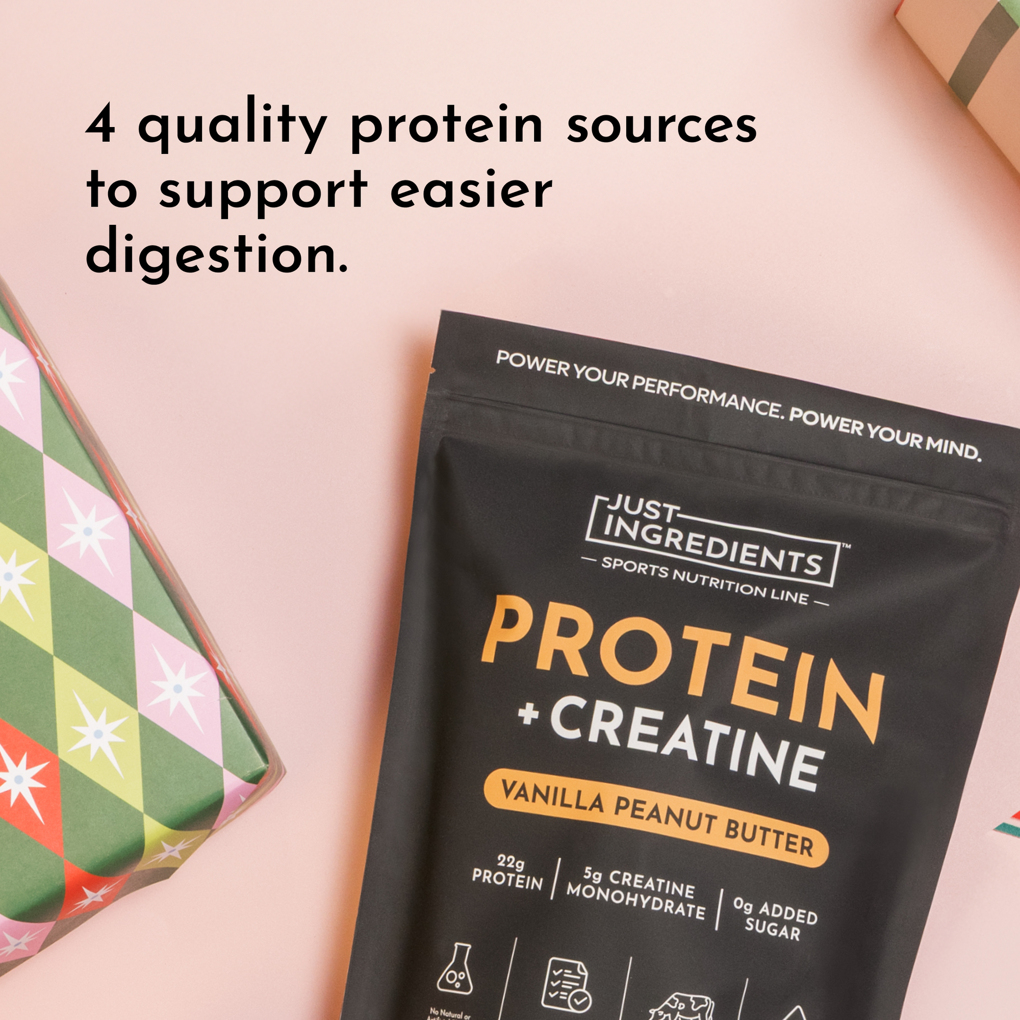 Black packaging of protein powder labeled "Protein + Creatine" in vanilla peanut butter flavor, with decorative gift wrapping