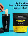 Hand holding scoop of cream-colored powder over black shaker cup next to black and yellow Golden Cherry recovery drink pouch 